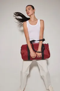 Recycled tube bag with front pocket