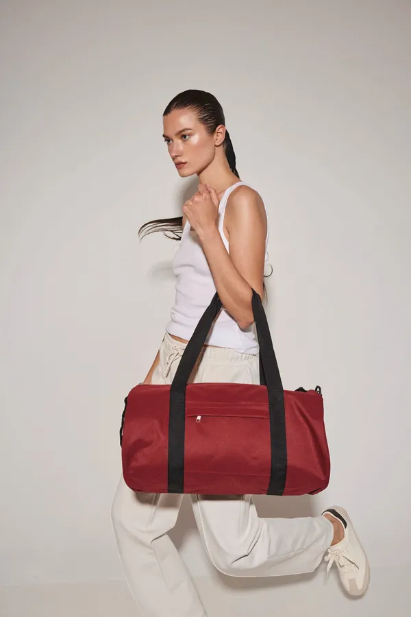 Recycled tube bag with front pocket