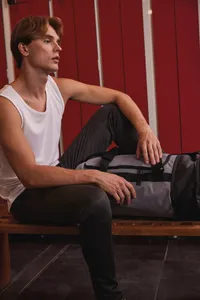 Tubular sports bag with separate shoe compartment