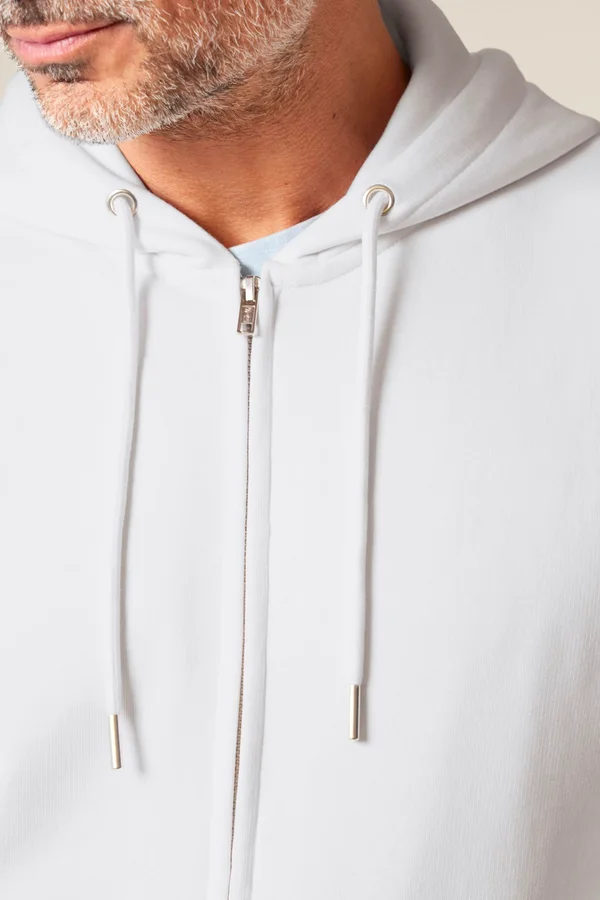Der Unisex-Zip-Hoodie aus French Terry