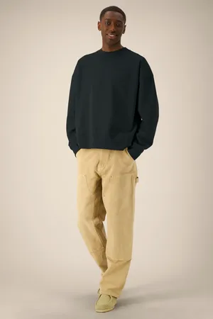 Das Boxy Rundhals-Unisex-Sweatshirt aus recycelter Baumwolle