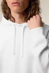 Der Unisex-Hoodie mit Seitentaschen